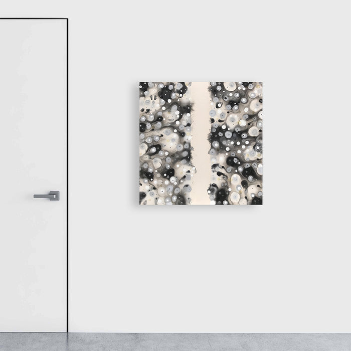 The artwork 'Getting Together' features a mesmerizing abstract composition of black, white, and gray circular forms creating a bokeh-like effect, split by a vertical cream-colored stripe. The acrylic on canvas piece showcases a dynamic interplay of light and dark spherical shapes, suggesting movement and unity. 35x35 inches by Eric Jiaju Lee.
