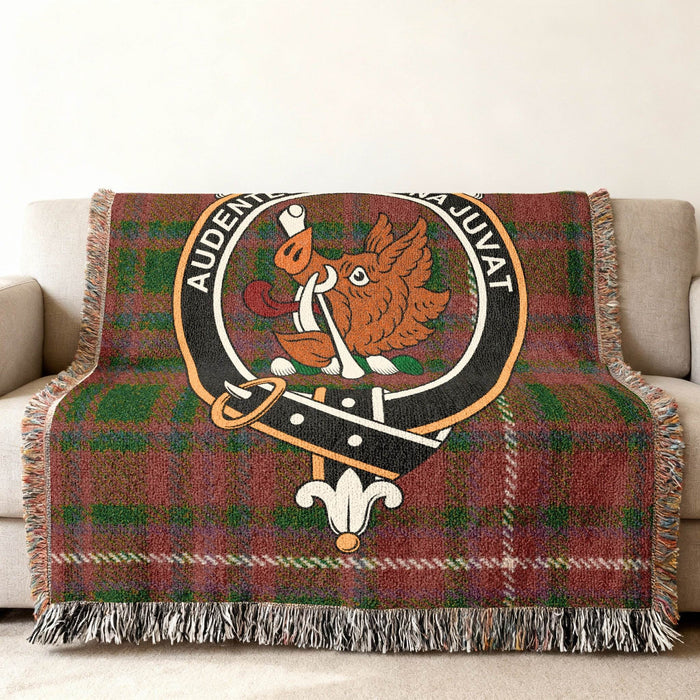MacKinnon Family Crest woven blanket draped across a sofa