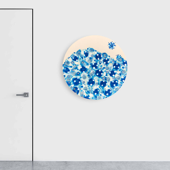 The artwork 'Cerulean Conception' by Eric Jiaju Lee features a circular canvas filled with dynamic splashes and dots in various shades of blue. The abstract composition resembles a celestial burst, with darker cerulean and cobalt forms scattered among lighter azure tones against a cream background, creating a flowing, organic pattern that extends to the circular edge of the canvas.