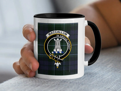 MacCallum In Ardua Tendit crest mug in hand — showing full tartan wrap and coloured handle