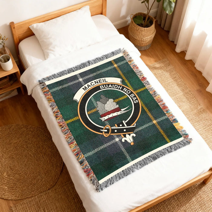 MacNeil Vincere Aut Mori clan crest woven into tartan blanket — cotton construction detail