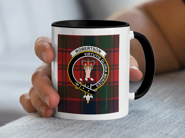 Black-accent Robertson crest mug held in a hand, showing the crown held above the wrist.