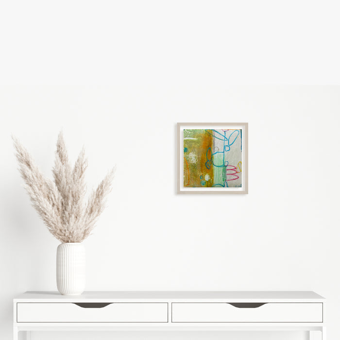 The artwork 'LS no. 3' by Janice La Motta features abstract expressionist composition with vibrant olive green and turquoise blue blocks, accented by playful curved lines in pink and blue. Created with oil pastel on Yupo paper, the 9x9 inch piece showcases textural elements and spontaneous mark-making, framed in white. By Janice La Motta.