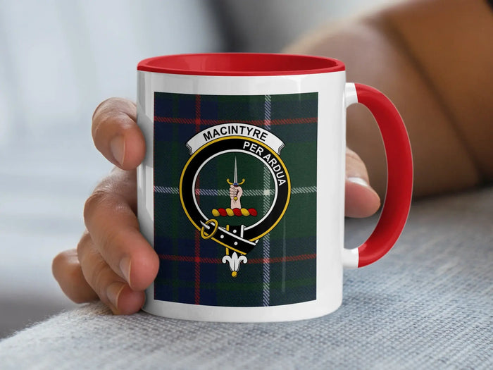 MacIntyre crest mug held in hand with red handle