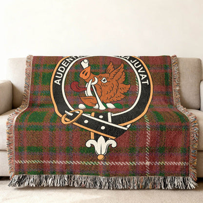 MacKinnon Family Crest woven blanket draped across a sofa