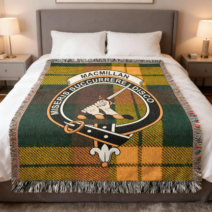 MacMillan woven blanket on bed with crest