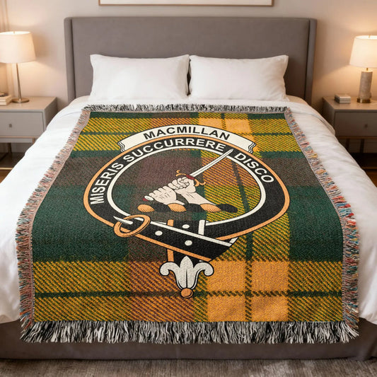 MacMillan woven blanket on bed with crest