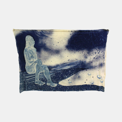 The artwork 'Open to Interpretation' by Johanna Ryan features a dreamy cyanotype composition on tea-dyed muslin, depicting a contemplative silhouette against a dynamic deep blue and ivory background. Ethereal splatters and celestial-like patterns create a mystical atmosphere, while the textural contrasts between smooth and speckled areas enhance the piece's depth. The 50x84 inch artwork combines traditional photographic processes with contemporar
