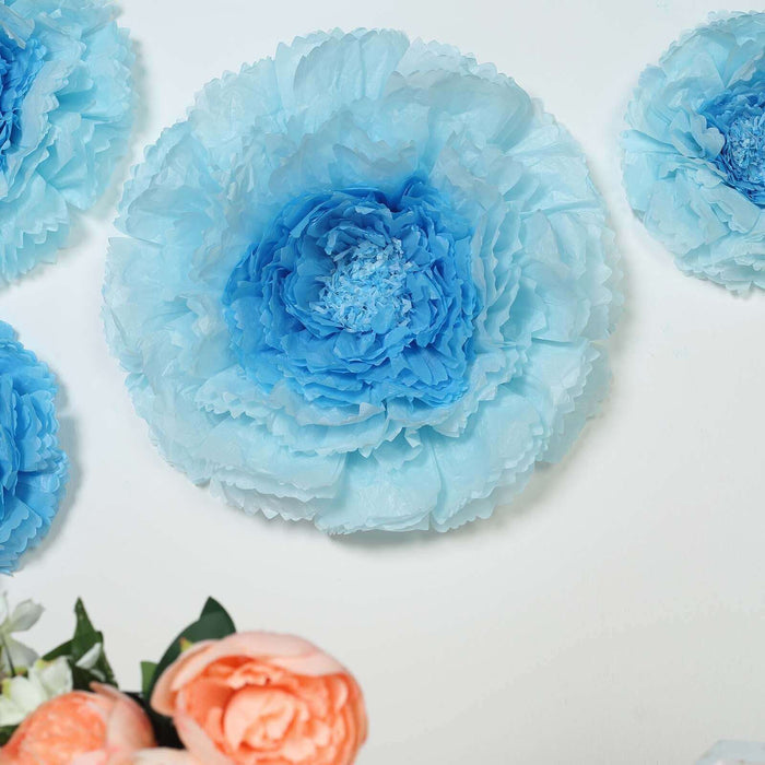Blue paper flowers arranged on a white background.