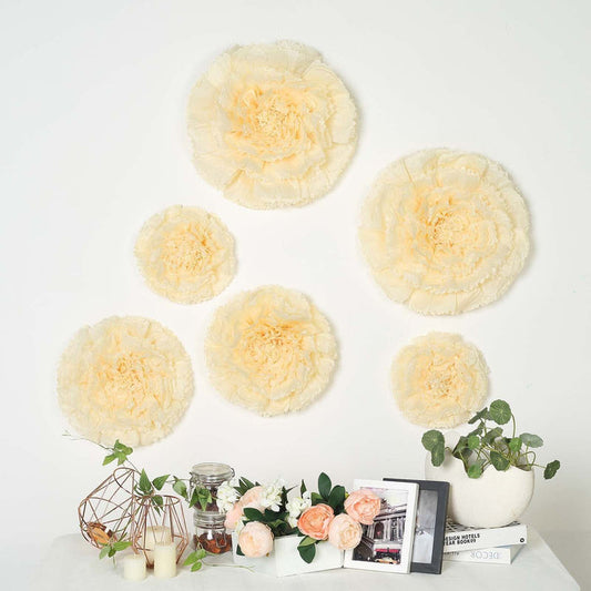 Peach floral wall decor set with various sizes and textures against a white wall.