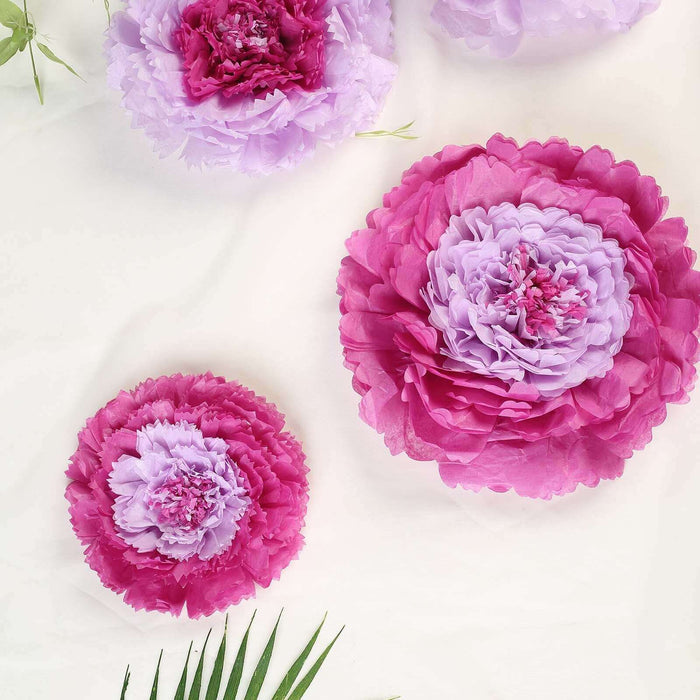 Pink and lavender paper flowers arranged on a light background.