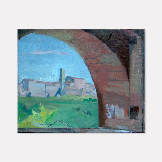 The artwork 'Through the Arch, Casole' by Peter Colquhoun captures a scenic Italian landscape viewed through a rustic stone arch. The oil painting on linen features muted terracotta tones in the foreground arch, contrasting with vibrant blue skies and verdant green meadows. A distant medieval village with distinctive architecture is framed within the arch's curve.